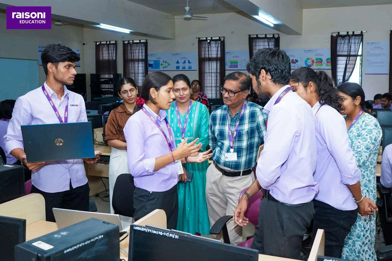 AI Project Demonstration - Students presenting GenAI project with laptop to faculty